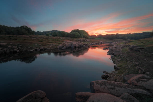 istock Sunset reflected in the waters of the river 1353981939