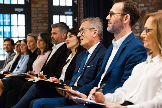 istock Entrepreneurs on business seminar 1353982088