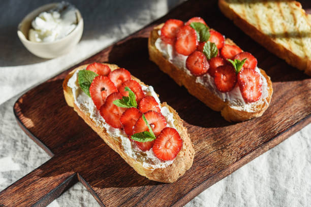 istock Bruschetta with strawberry and cream cheese 1353983266