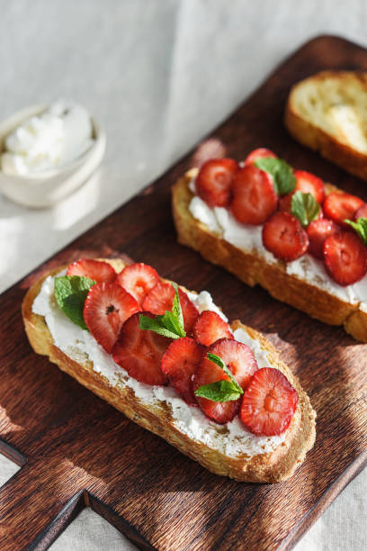 istock Bruschetta with strawberry and cream cheese 1353983270