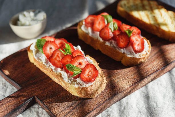 istock Bruschetta with strawberry and cream cheese 1353983271