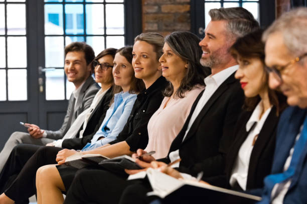 istock Entrepreneurs on business seminar 1353984002