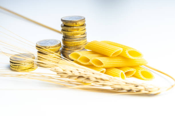 Wheat, pasta and money. Increase in the price of wheat and products. stock photo