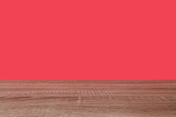 istock Wooden surface and red background 1353985598