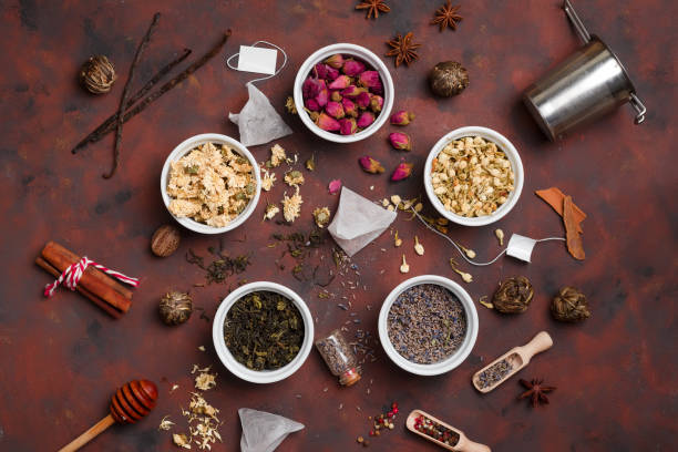 istock Dry tea with in wooden spoons. Top view 1353986586