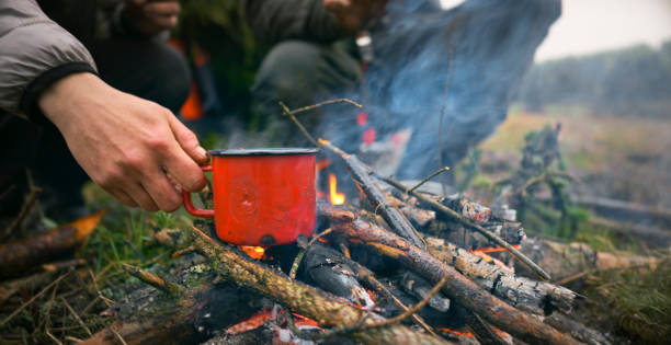 istock Close-up of red cup placing on campfire 1353987017