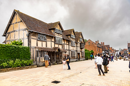 Shakespeare's birthplace and Shakespeare Centre, Henley Street, Stratford Upon Avon, Warwickshire, England, UK. This is the building that William Shakespeare was born and grew up in. He was the son of a wealthy glove maker, John Shakespeare, and had a privileged upbringing.