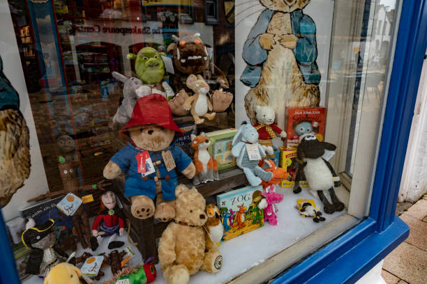 Assorted British children's characters in a shop window display Assorted British children's characters in a shop window display in Stratford upon Avon, Warwickshire, England, UK. winnie the pooh photos stock pictures, royalty-free photos & images