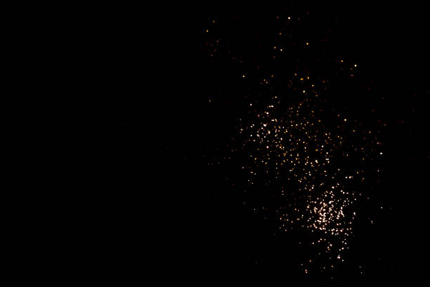 istock Golden abstract bokeh on black background. 1353988532