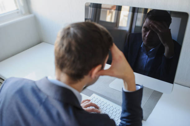 istock young man working on the computer in a light gray room 1353988562