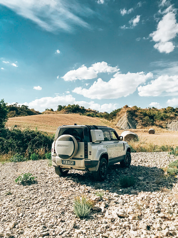 Campo Imperatore, Italy - July 26, 2021 : The New Land Rover Defender parked on hills in Tuscany