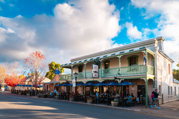 The Hahndorf Inn German restaurant with people sitting outside Hahndorf, Adelaide Hills, South Australia - April 24, 2021: The Hahndorf Inn German restaurant with people sitting outside viewed from the Main street during autumn evening at sunset traditionally australian stock pictures, royalty-free photos & images