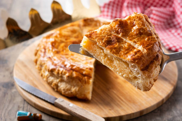 Galette des rois Galette des rois on wooden table. Traditional Epiphany cake in France january in spanish stock pictures, royalty-free photos & images