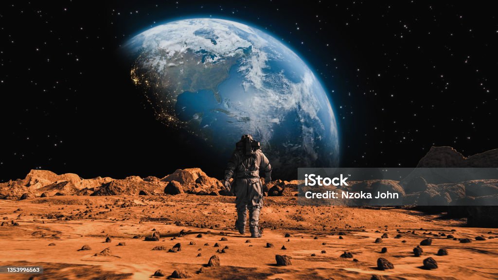 Following Shot of Brave Astronaut in Space Suit Confidently Walking on Mars to Earth, Alien Red Planet Covered in Rocks. First Astronaut On the Mars. Advanced Technologies, Space Exploration/ Travel, Colonization Concept. Big Moment for the Human Race. Following Shot of Brave Astronaut in Space Suit Confidently Walking on Mars Towards Earth Planet. Earth Planet as viewed from Mars surface. The surface of Mars, strewn with small rocks and red sand. Martian landscape in rusty orange shades, Mars Planet surface, Desert, Cliffs, sand. Red planet mars. Alien Red Planet Covered in Rocks. First Astronaut On the Mars. Big Moment for the Human Race. Advanced Technologies, Space Exploration/ Travel, Colonization Concept. Mars - Planet Stock Photo