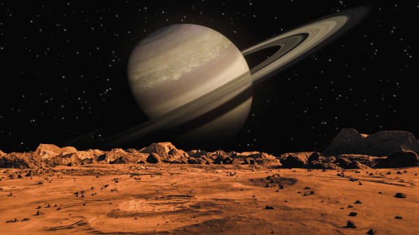 istock Saturn seen from Mars surface. The surface of Mars, strewn with small rocks and red sand. Martian landscape in rusty orange shades, Mars Planet surface, Desert, Cliffs, sand. Red planet mars. Conception space abstract background. 1353996716