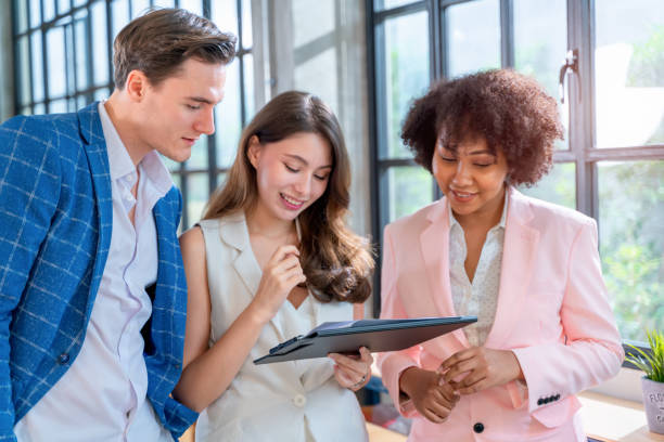 istock The multi-ethnicity discussion about the work for with friendship relation in the warm light office. Cooperate business. 1353999675