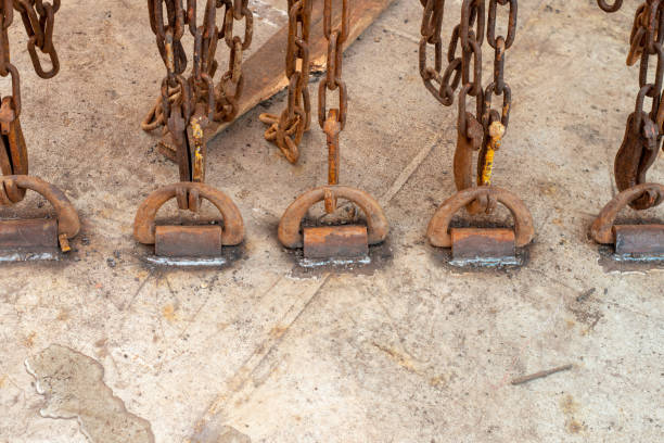 istock Safe cargo lashing onboard of ship deck with cargo lashing chains and tensioner. 1353999959
