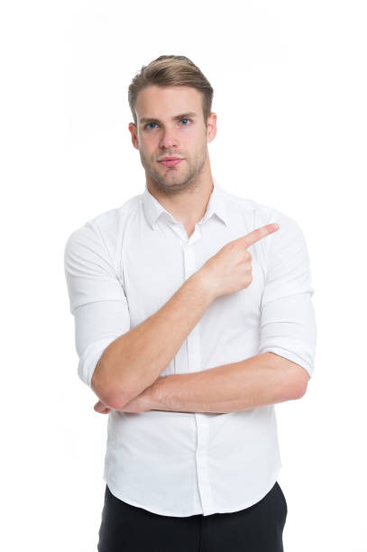 istock Check it out. Man well groomed white collar shirt isolated white background pointing index finger. Advertisement concept. Macho confidently pointing direction. Guy office worker shows direction 1354004665