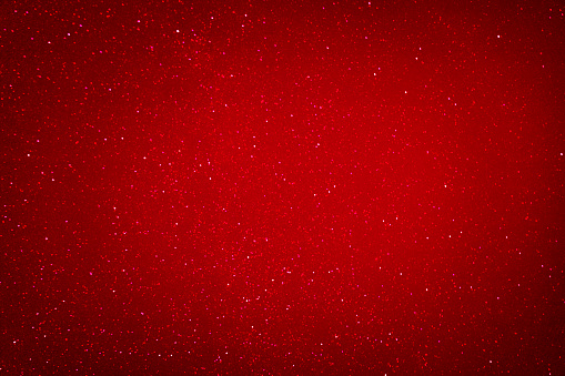 Bright red background. Christmas, New Year, Valentine's Day background. Background with glitter. Copy space.