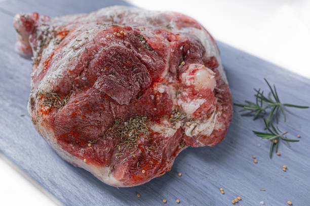 istock raw meat on wooden board 1354012427