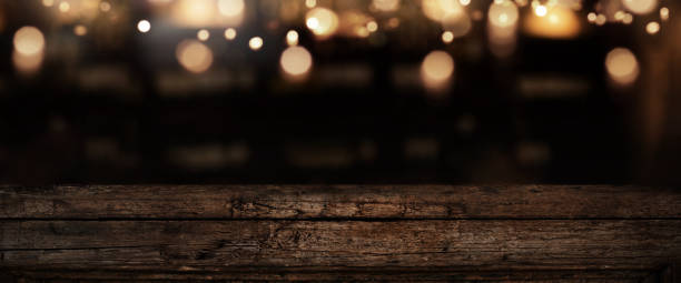 istock Iluminated old weathered wooden counter 1354013895