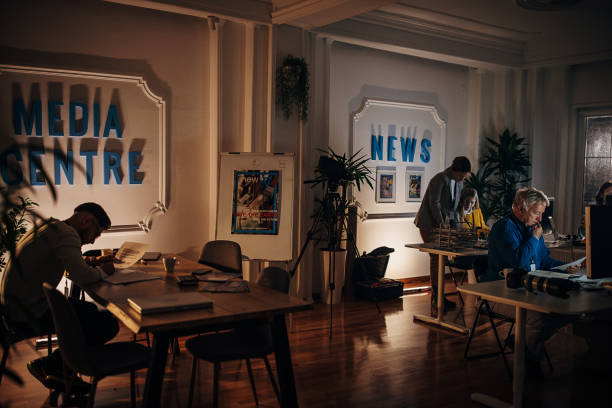 istock Busy night in news editorial office 1354015361