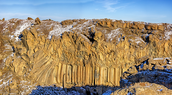 Panorama of basalt columns at Aldeyjarfoss waterfall, Iceland. The columns were formed some 9000 years ago from cooling magma from a volcanic event. Northern Iceland.