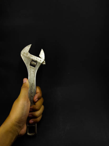 istock Adjustable Wrench on black - stock photo 1354019101