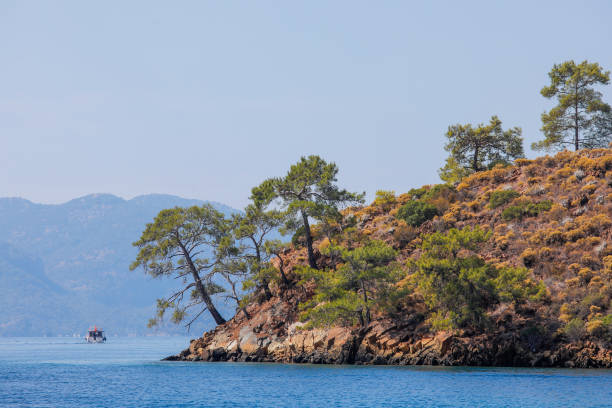 istock Blue sea, boat and sea coast 1354019617