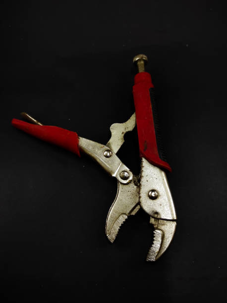 istock Adjustable pliers on black - stock photo 1354020403