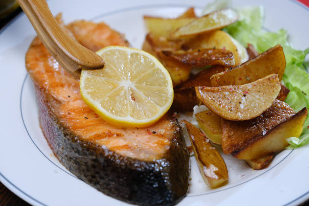 istock Serving and eating salmon steak and potato 1354022476