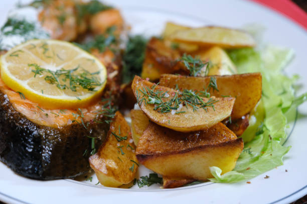 istock Serving and eating salmon steak and potato 1354022677