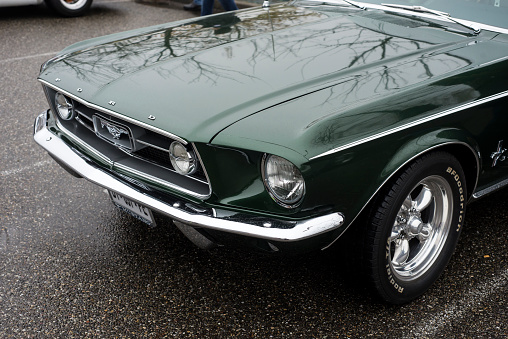 Mulhouse - France - 14 November 2021 - Front view of green Ford Mustang 1967 parked in the street