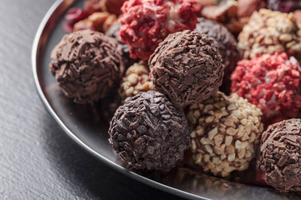 istock Chocolate candies with, nuts and dried strawberries. 1354024568