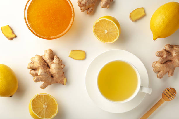istock Ginger tea with lemon and honey on white background. 1354025980