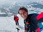 Portrait of backcountry skiing couple, smiling