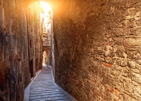 Perugia, Umbria, Italy. August 2021. A charming alley winds its way between the houses of the historic center.
