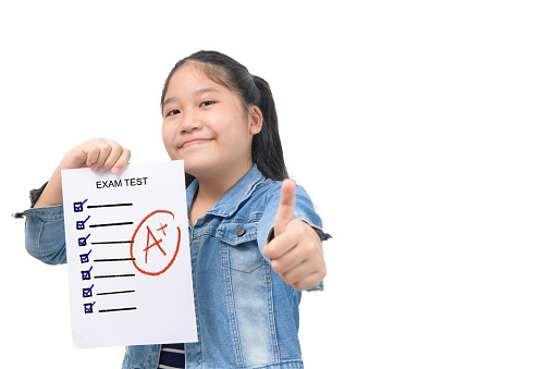 cute smart girl student showing  perfect grade test results isolated on white background, education concept