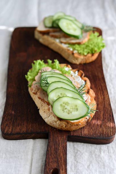 istock Sandwiches with chicken meat, cucumber, lettuce  and soft cheese 1354028462