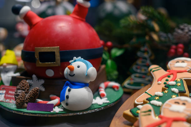 istock Christmas snow man and gingerbread cookie man wearing face mask 1354028476