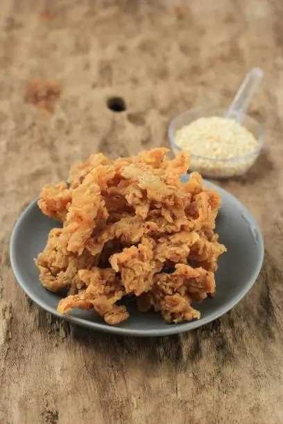 Photo of Crispy Fried Oyster Mushroom or Jamur Krispi. Oyster Mushroom Coated with Spiced Flour and Depp Fried. Usually Served with Tomato Sauce