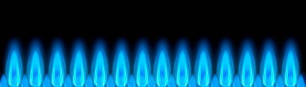 istock Blue gas flames as banners against a dark background 1354029029