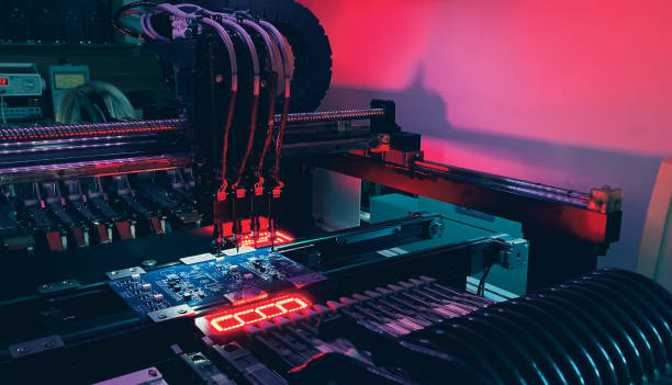 istock Automatic production of computer chips by SMT Pick and Place machine 1354029694