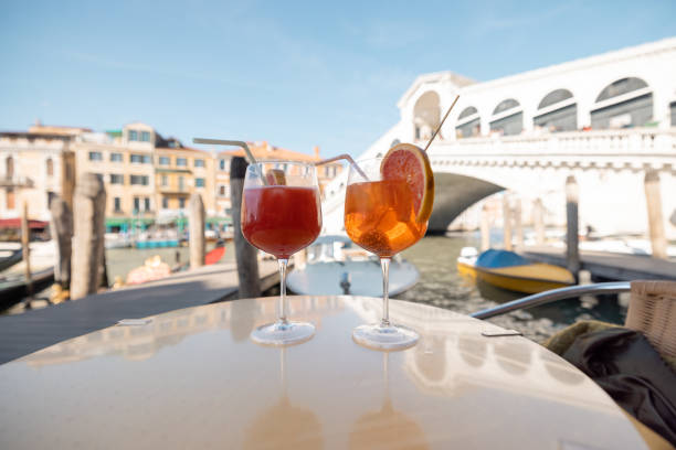 istock Two drinks at outdoor cafe in Venice, Italy 1354030121