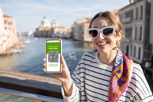 Woman with vaccination certificate while traveling in Italy