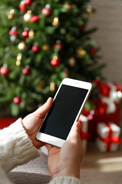 istock Woman holding a phone 1354031265