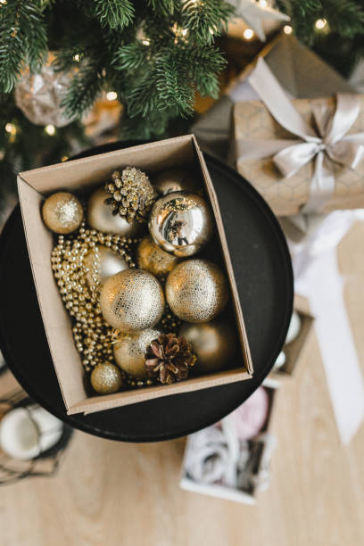 istock Box with golden Christmas balls. 1354031645