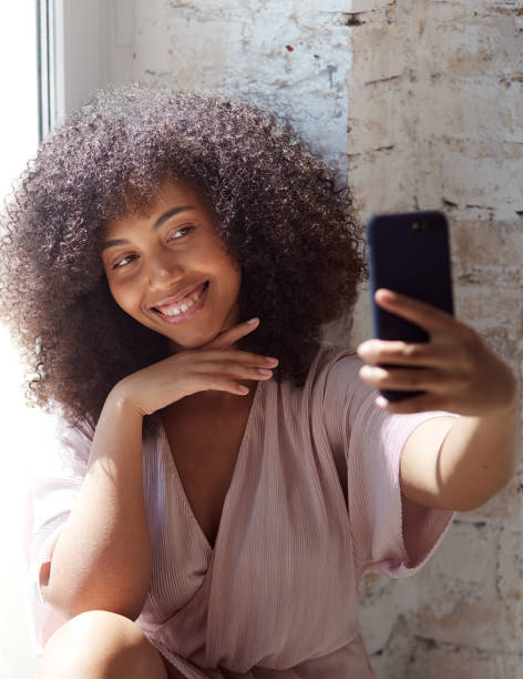 istock Female vlogger influencer sit at home speaking looking at camer 1354033923