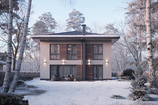 Computer generated image of a house with large garden and snow covered lawn in 3d rendering. Bungalow surrounded by trees on a winter day.
