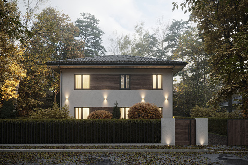 3d rendering of modern cozy house. Digitally generated image of a modern house in luxurious style on autumn day.